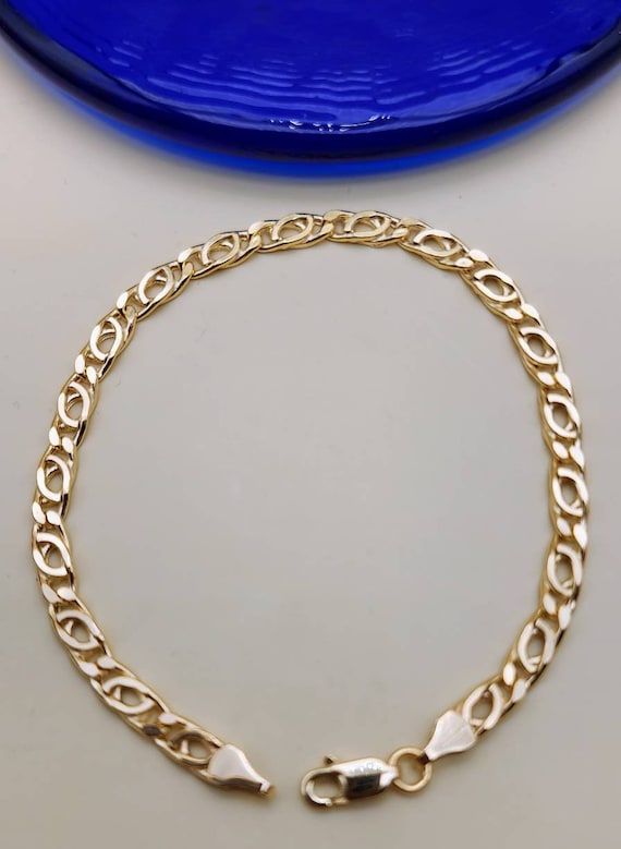 Bracciale in oro bianco 18k a maglia morbida con diamanti bianchi taglio a brillante e zaffiri blu