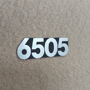 6505 silver amplifier logo