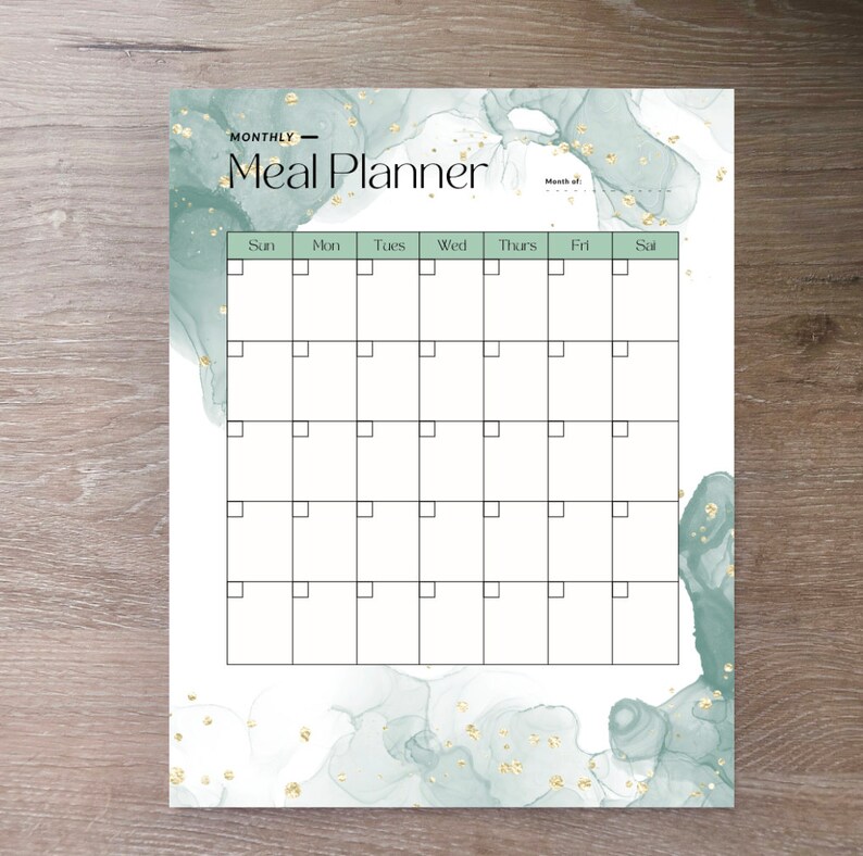 May include: A printable monthly meal planner with a green and gold watercolor background. The planner has a grid with boxes for each day of the week, labeled Sun, Mon, Tues, Wed, Thurs, Fri, Sat. The text "MONTHLY - Meal Planner" is at the top of the page.