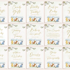 K&ouml;nnte beinhalten: Ein Set mit 12 druckbaren Winnie-the-Pooh-Babyparty-Schildern mit goldenen Schriftz&uuml;gen und Illustrationen von Winnie Puuh, Ferkel, Tiger und Esel. Die Schilder beinhalten Titel wie "Windel-Tombola", "Karten und Geschenke", "Rumbly Tumbly?", "Buch f&uuml;r Baby", "Bitte genie&szlig;en Sie etwas Essen", "W&uuml;nsche f&uuml;r Baby", "Ein kleines Leckerli f&uuml;r Ihren Bauch", "Babys sind s&uuml;&szlig;", "Zeitkapsel", "Bitte tragen Sie sich in unser G&auml;stebuch ein", "Mitbringsel", "Ratschl&auml;ge und W&uuml;nsche", "Getr&auml;nke", "Erraten Sie, wie viele Honigwaben", und "Mimosabar".