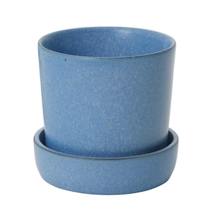 May include: A blue ceramic plant pot with a matching saucer. The cylindrical pot has a textured surface and a slightly flared rim. The saucer is a shallow, round dish. Suitable for small plants, this pot measures approximately 10 cm in height.
