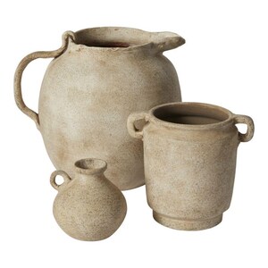 May include: Three ceramic pots in various sizes, all with a rustic, distressed finish. The largest pot has a handle and a rounded shape, while the medium pot has two handles and a cylindrical shape. The smallest pot is round and has a small handle.