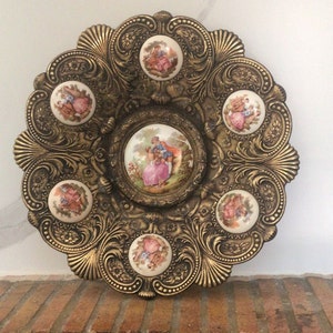 Antique decorative plates.  Bronze and porcelain. Antique wall decoration, limousine