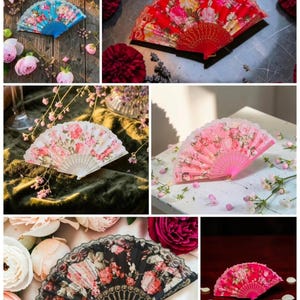 May include: A collection of six folding hand fans featuring floral patterns in blue, red, white, pink, and black. Each fan displays a distinct color scheme with intricate rose motifs and matching plastic or lace frames, presented in various settings.