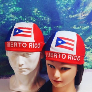 May include: Two red, white, and blue headbands with the Puerto Rican flag and the words "PUERTO RICO" printed on them.