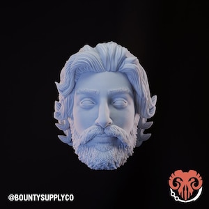 May include: A light blue bust of a bearded man with long wavy hair. The sculpture has a detailed beard and mustache, with closed eyes. The text "@BOUNTYSUPPLYCO" is at the bottom left. The background is black.