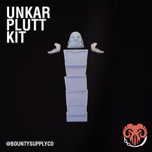 May include: A light blue Unkar Plutt Kit, featuring a head, arms, and a stack of rectangular components. The text "UNKAR PLUTT KIT" is displayed in white, along with the @BOUNTYSUPPLYCO logo on a black background.
