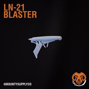 May include: A white plastic toy blaster with the text "LN-21 BLASTER" on a black background. The toy blaster has a futuristic design with a handle and a barrel.
