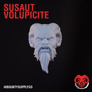 May include: A 3D printed miniature head of a creature with a long beard and horns. The creature has a fierce expression with sharp teeth and a furrowed brow. The head is painted in a light gray color.