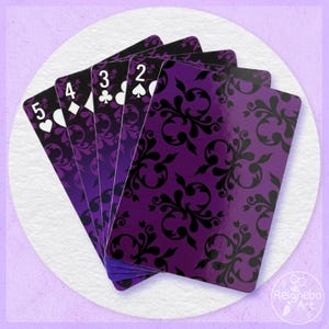 May include: A fan of five playing cards featuring a dark purple and black damask pattern. The cards display the numbers 2, 3, 4, and 5 with their respective suit symbols in white. The bottom right corner includes the text Reignebo Art.