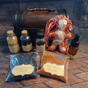 May include: A collection of mystical items, including small glass bottles labeled "Bone Dust", "Corpse Blood", and "Corpse Powder", along with pouches of "Graveyard Dirt" and "Hot Foot Powder". A handmade doll and a small chest are also present.