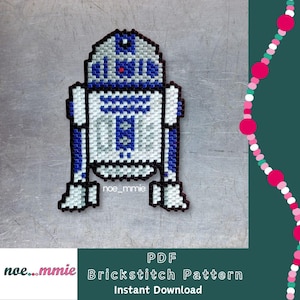 May include: A pixelated R2-D2 design in white, blue, and black, likely a beadwork pattern. The design is on a metallic gray surface. Text at the bottom reads "PDF Brickstitch Pattern Instant Download" and the artist's name.
