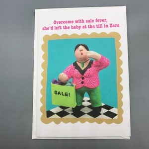 Overmand door verkoopkoorts had ze de baby achtergelaten bij de kassa in Zara, A5-kaart, blanco binnenin