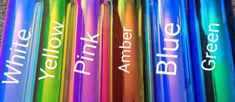 May include: Six iridescent bottles with labels reading "White", "Yellow", "Pink", "Amber", "Blue", and "Green".