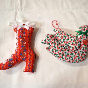 May include: A white ceramic mug with a black handle and the text "But First, Coffee" in a bold, black font. The mug is set against a neutral background, highlighting its simple design.