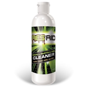 May include: A white plastic bottle with a green and black label. The label says "RES-RID SMALL PARTS & RIG CLEANER GLASS - CERAMIC - METAL - SILICONE 16 FL OZ".