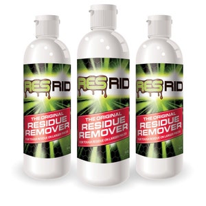 May include: Three white plastic bottles with green and red labels. The labels read "RESRID THE ORIGINAL RESIDUE REMOVER FOR TOUGH RESIDUE ON LARGER PIECES".