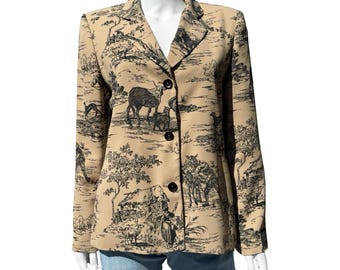 May include: Beige blazer with a black and white pastoral scene print. The blazer has a notched collar, long sleeves, and three black buttons. The print depicts animals, trees, and buildings. The blazer is displayed on a mannequin.