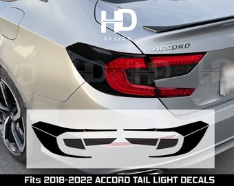 May include: A silver Honda Accord with black tail light decals. The decals are designed to cover the taillights and give them a blacked-out look. The decals are compatible with 2018-2022 Accord models. Fits 2018-2022 Accord Tail Light Decals