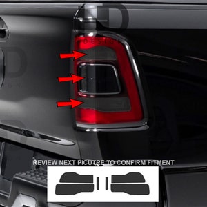 May include: Black taillight covers for a pickup truck. The covers are designed to fit over the taillights and give them a smoked look. The image shows the covers installed on the truck. The text "REVIEW NEXT PICTURE TO CONFIRM FITMENT" is visible in the image.