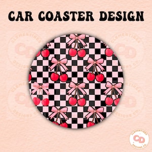 May include: A round car coaster with a black and pink checkered pattern and pink bows with red cherries on top.
