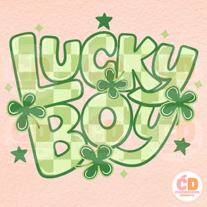 May include: A digital graphic with the words "LUCKY BOY" in a green, bubble-style font with a checkered pattern. The design includes green shamrocks and stars on a light pink background, perfect for St. Patrick's Day.