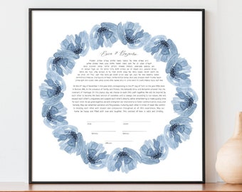 May include: A framed blue watercolor floral ketubah with the text "Love & Blessings" at the top. The ketubah is a Jewish wedding contract.