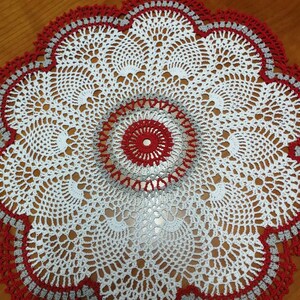 Red, grey and white pineapple doily. 17ins diameter