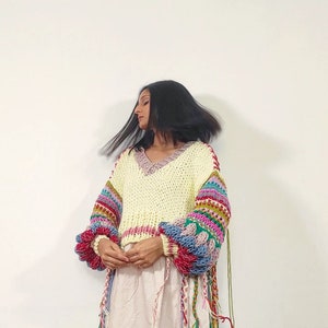Hand knit 'Spring's Symphony' multicolored, oversized pullover with jacquard structural texture, hand embroidery & handmade braids detailing image 5