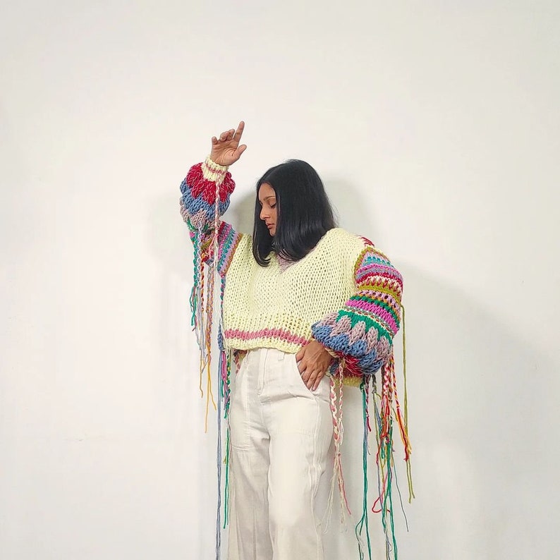 Hand knit 'Spring's Symphony' multicolored, oversized pullover with jacquard structural texture, hand embroidery & handmade braids detailing image 3