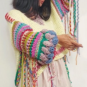 Hand knit 'Spring's Symphony' multicolored, oversized pullover with jacquard structural texture, hand embroidery & handmade braids detailing image 9