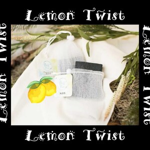 May include: A product image featuring the text "Lemon Twist" in a decorative font. The image showcases several small, square soap bars in mesh bags, along with a pair of illustrated lemons. The background includes greenery and a white cloth.