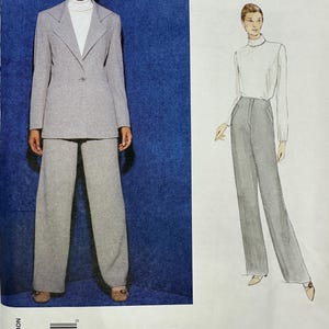 May include: An Anne Klein Vogue American Designer sewing pattern envelope 1871 for a two-piece suit. The image shows a grey blazer with a single button and matching wide-leg trousers, paired with a white turtleneck, alongside a fashion illustration.