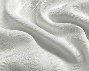 May include: White fabric with a subtle embossed floral pattern. The fabric is soft and has a slight sheen.