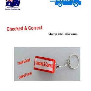 May include: Red keychain stamp with the words "Checked & Correct" printed on it. The stamp is attached to a silver key ring. The stamp measures 10 mm by 27 mm.