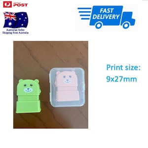 May include: Two small plastic stamps in clear cases. The stamps are shaped like bears with green and pink faces. The print size is 9x27mm.