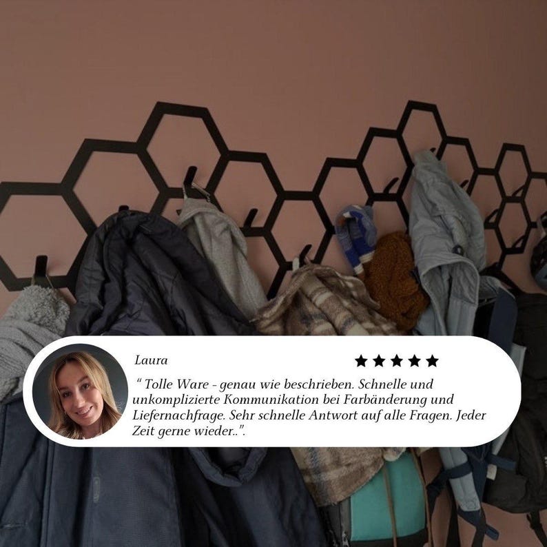May include: A wall-mounted coat rack with a black honeycomb design. Various coats and jackets hang from the hooks. A customer review with a photo is in the lower left corner.