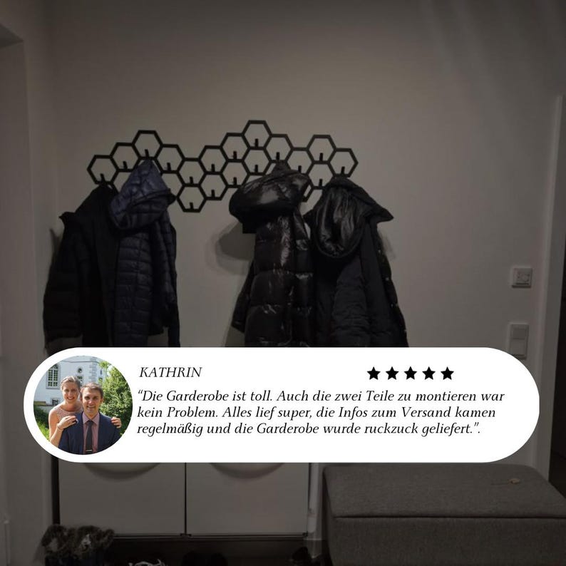 May include: A black honeycomb-shaped wall-mounted coat rack with several black jackets hanging on it. The rack is mounted on a white wall. A customer review is visible at the bottom of the image.