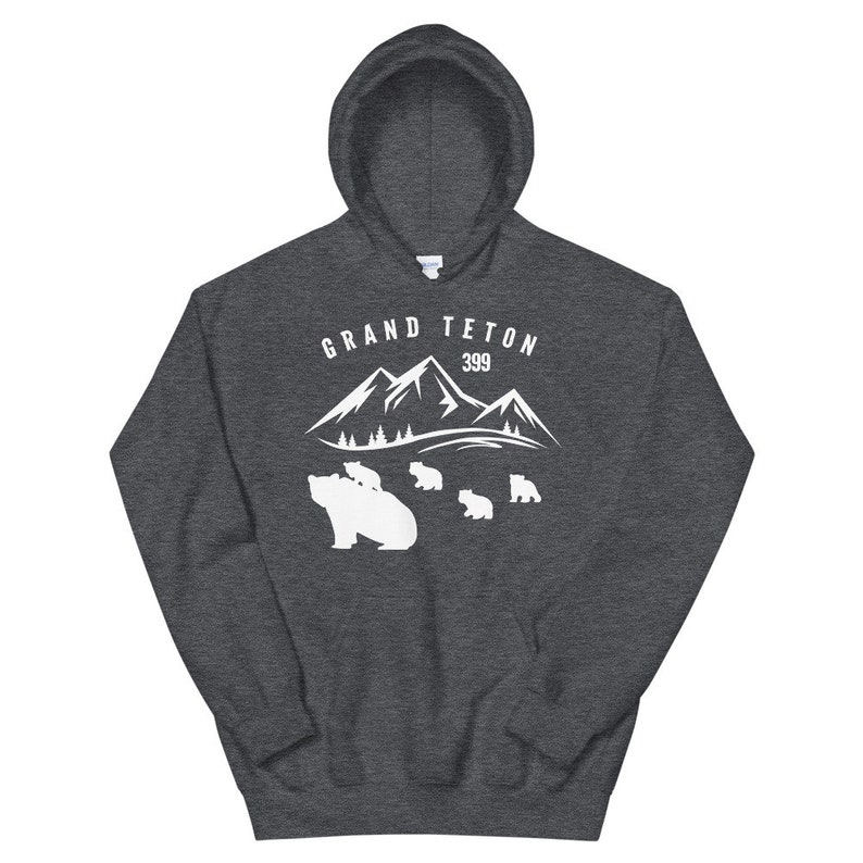 May include: A dark grey hooded sweatshirt with a white graphic design of a mountain range with the text "GRAND TETON 399" and a mother bear with cubs.
