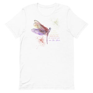May include: White t-shirt with a watercolor illustration of a dragonfly and the text "Things are not always what they seem she whispered back I am the storm"