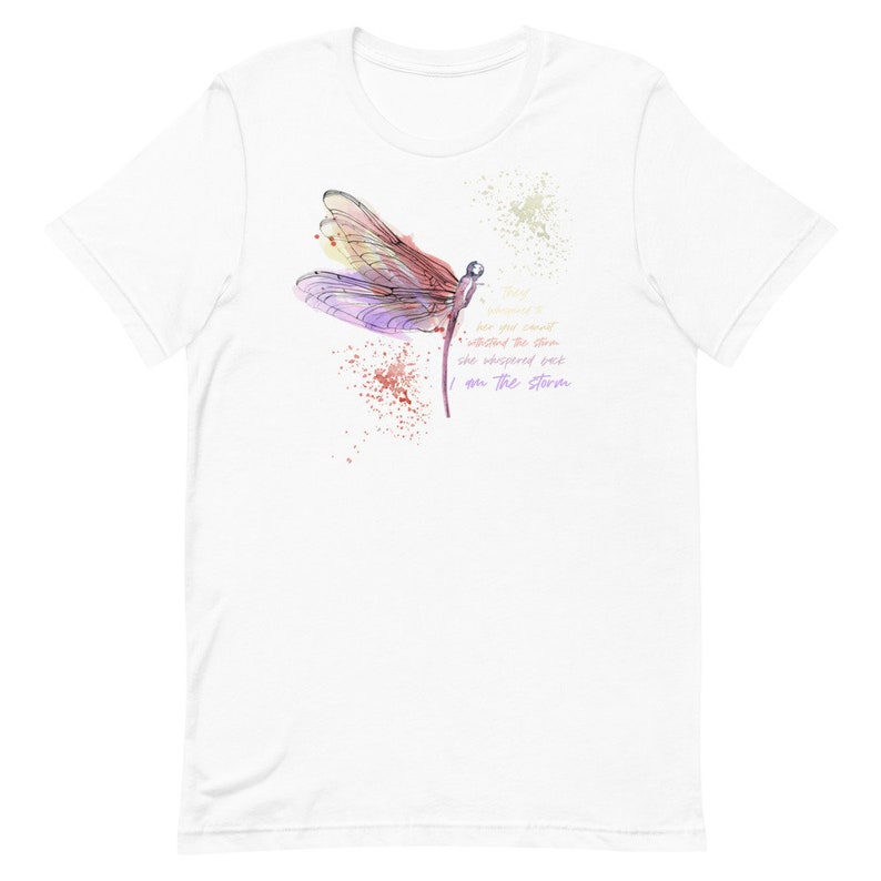 May include: White t-shirt with a watercolor illustration of a dragonfly and the text "Things are not always what they seem she whispered back I am the storm"
