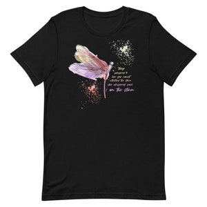 May include: Black t-shirt with a watercolor dragonfly design and the text "They whispered to her you cannot withstand the storm she whispered back I am the storm".