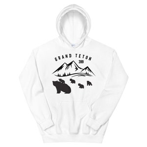 May include: White hooded sweatshirt with a black graphic of mountains and bears. The text "GRAND TETON 399" is printed above the graphic.