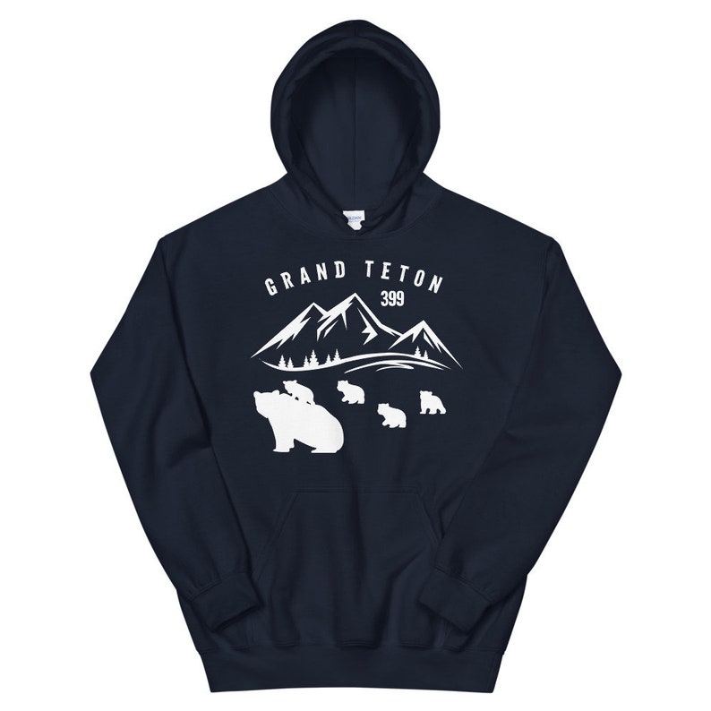 May include: Navy blue hooded sweatshirt with a white graphic of mountains and bears. The text "GRAND TETON 399" is printed on the sweatshirt.