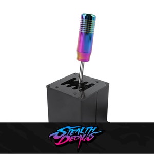 May include: A black metal shifter base with a rainbow colored shift knob. The shift knob has a textured grip.