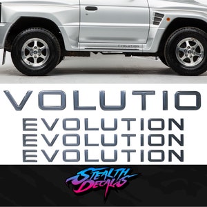 May include: Set of four black "EVOLUTION" decals. The decals are made from high-quality vinyl and are designed to last for years. They are perfect for adding a touch of style to your car, truck, or SUV.