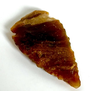 Neolithic flint stone hand hewn knapped amber brown fine point arrowhead