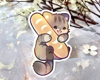 May include: A cartoon illustration of a gray and white cat holding a long, light brown baguette in its paws. The cat has a happy expression and is looking at the viewer.