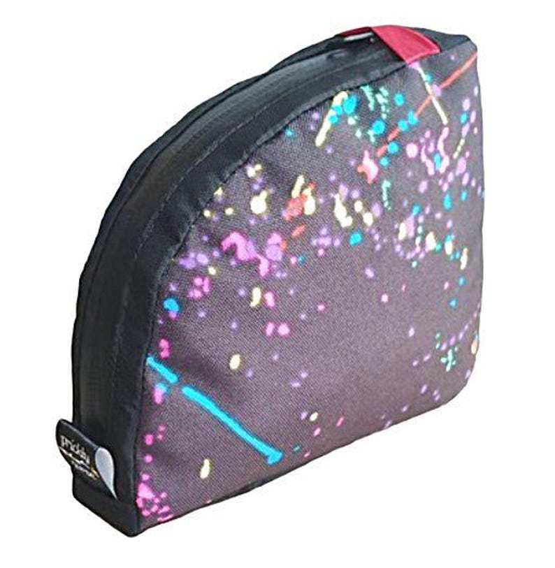 May include: A black and gray makeup bag with a colorful confetti pattern. The bag has a zipper closure and a red pull tab.