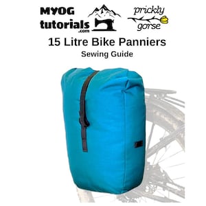 May include: A turquoise blue 15-liter bike pannier with black straps and a black handle. The pannier is attached to a bike rack with a black metal frame and a black tire.